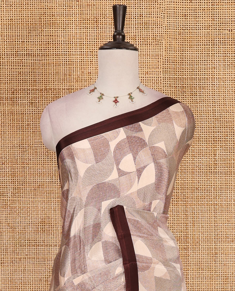 Beige geometric patterns printed Turkey crepe saree, contrast printed piping border, printed pallu, and printed blouse