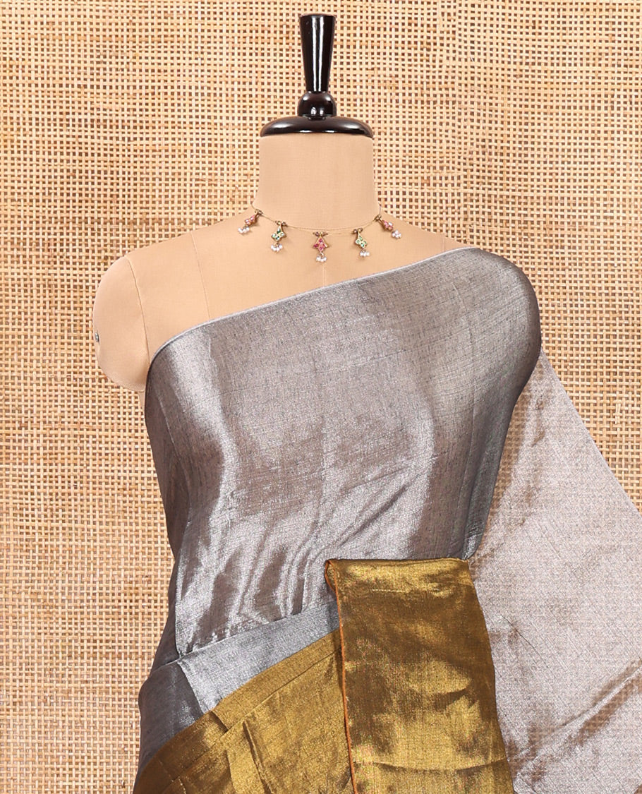 Silver and gold half-and-half plain khadi tissue saree with a self-pallu and a matching blouse