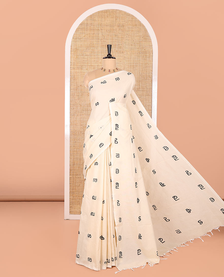 Borderless Cream South Cotton Saree, Accentuated with Malayalam Letter Motifs Printed All Over Its Body, Pallu Mirrors the Same Print, and Paired with a One Matching Blouse, and One Contrast Printed Blouse