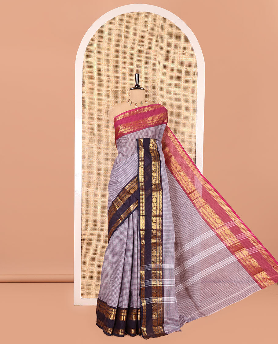 Grey Chettinad Cotton Saree, Subtly Sparkled with Micro-Checked Designs on Its Body, Complemented by Contrast Rettai Pettu Traditional Zari Design Ganga-Jamuna Border, Subtly Striped Pallu, and Paired with a Matching Blouse