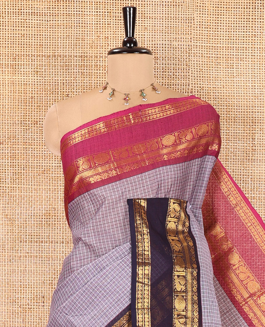 Grey Chettinad Cotton Saree, Subtly Sparkled with Micro-Checked Designs on Its Body, Complemented by Contrast Rettai Pettu Traditional Zari Design Ganga-Jamuna Border, Subtly Striped Pallu, and Paired with a Matching Blouse