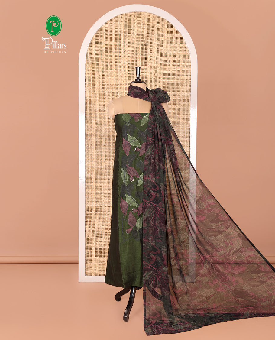 Green Vichitra Silk Designer Material Chudidar Set, Beautiful Bedecked with Floral Cross-Stiched Embroidered Top, A Subtly Plain Santoon Bottom, and Paired with a Georgette Abstract Printed Dupatta