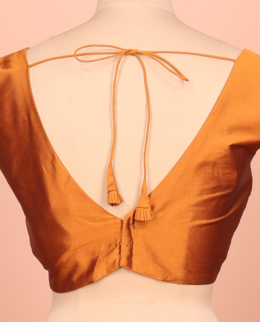 Orange Plain Readymade Blouse Featuring a Front V-Neck, Back Deep V-Neck, and Sleeveless