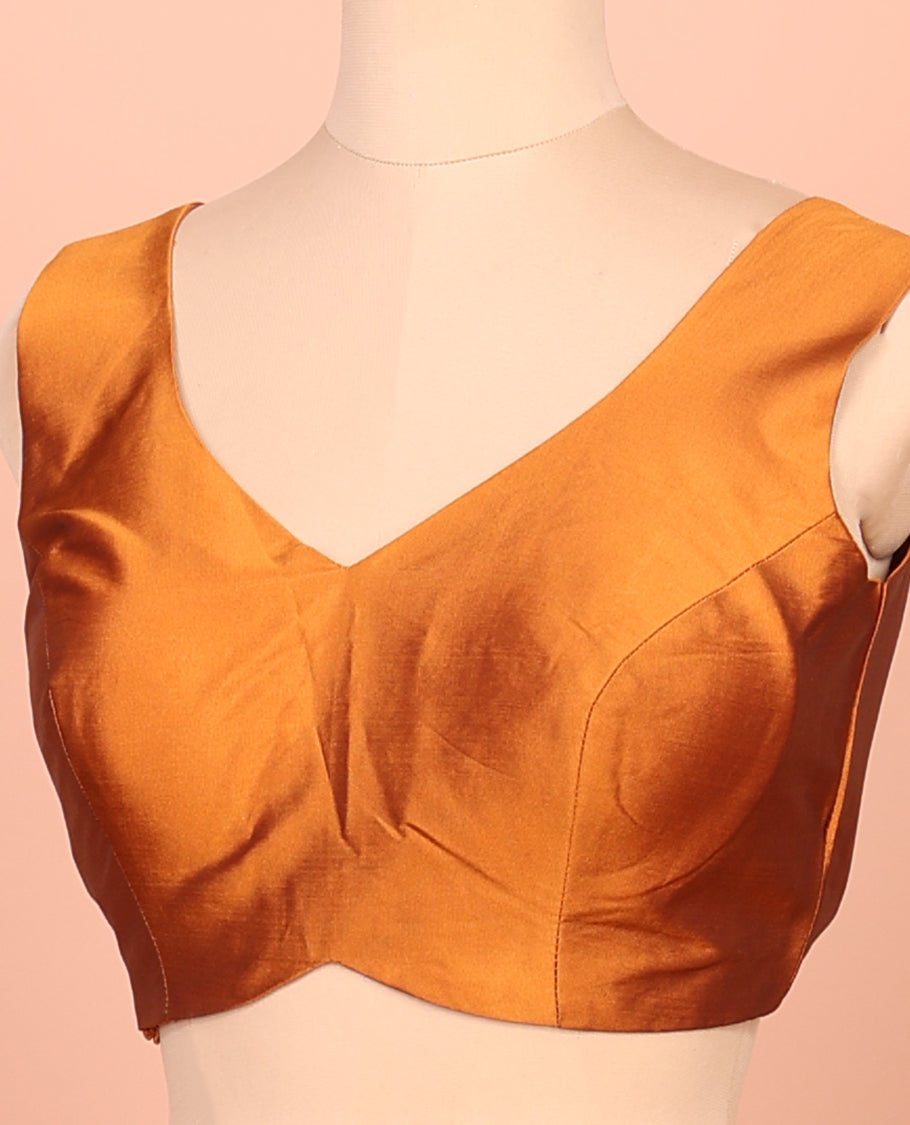 Orange Plain Readymade Blouse Featuring a Front V-Neck, Back Deep V-Neck, and Sleeveless
