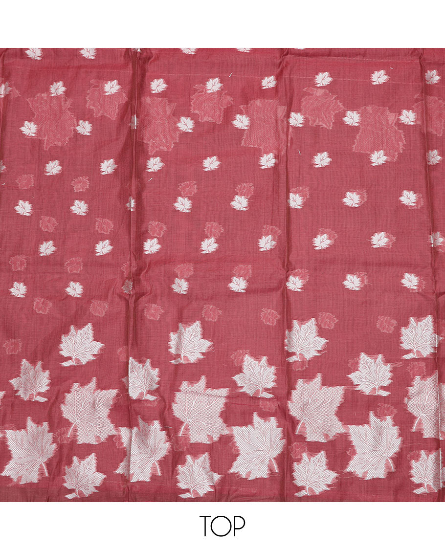 Pink material churidar set, leaf motifs top, plain bottom, and a dupatta steeped with leaf motifs