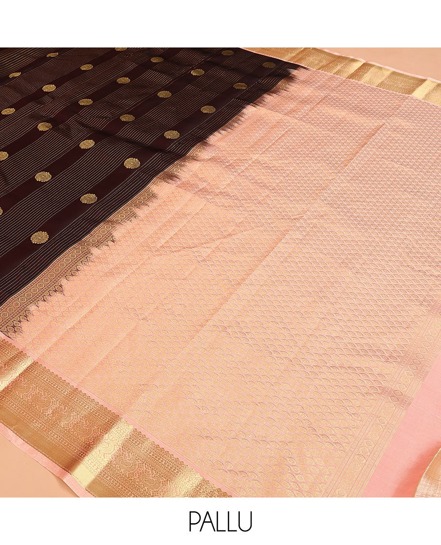 Brown Vasundhara Lite Silk Mix Saree, Prettified with Stripes, and Chakram Buttas, Complemented by a Contrast Border of Thilakam Mokku, Muthu, Banaras, Neli, and Mayil Designs, Pallu Steeped with Peacock Feather Designs, and Paired with a Contrast Blouse