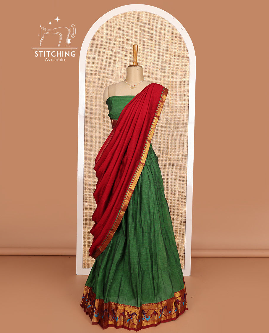 Green cotton half-saree, plain with contrast paithani style bordered skirt, matching blouse, and contrast temple border dhavani