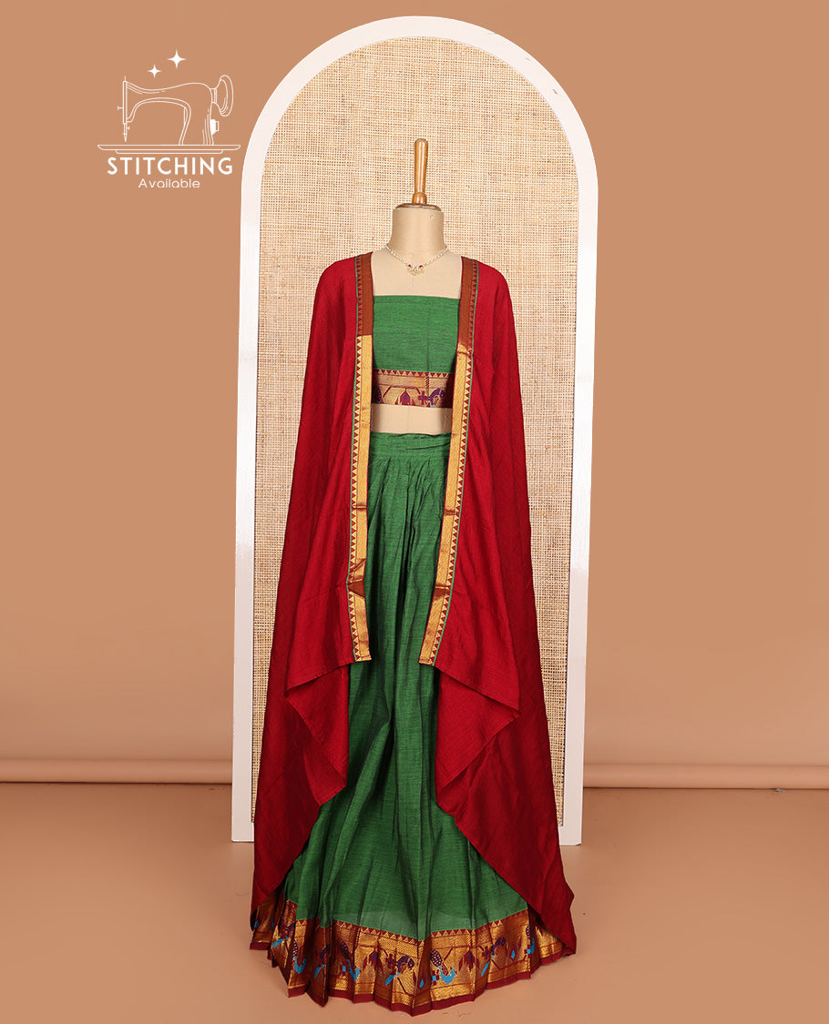 Green cotton half-saree, plain with contrast paithani style bordered skirt, matching blouse, and contrast temple border dhavani