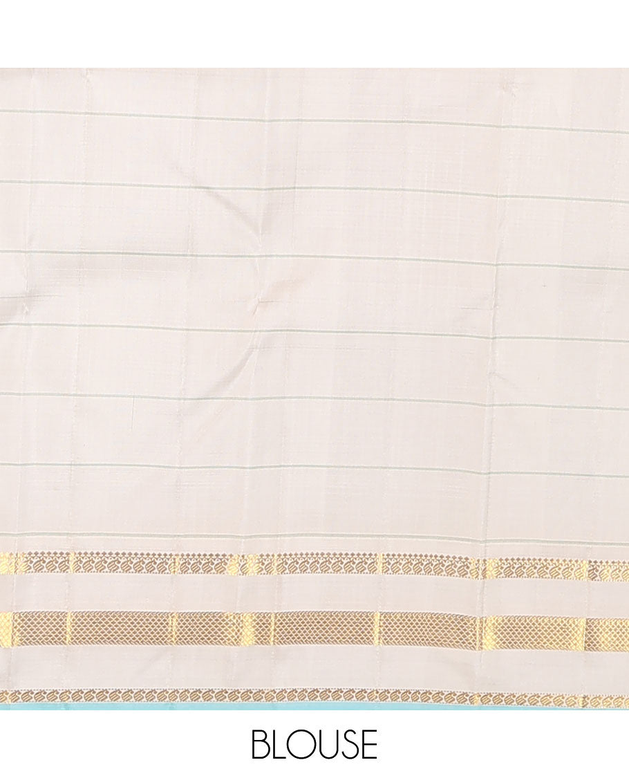 Baby pink checked Kanchipuram silk saree, contrast varisai pettu border of thilakam mokku, manga, and kuyil kann designs, and seppu rekku pallu