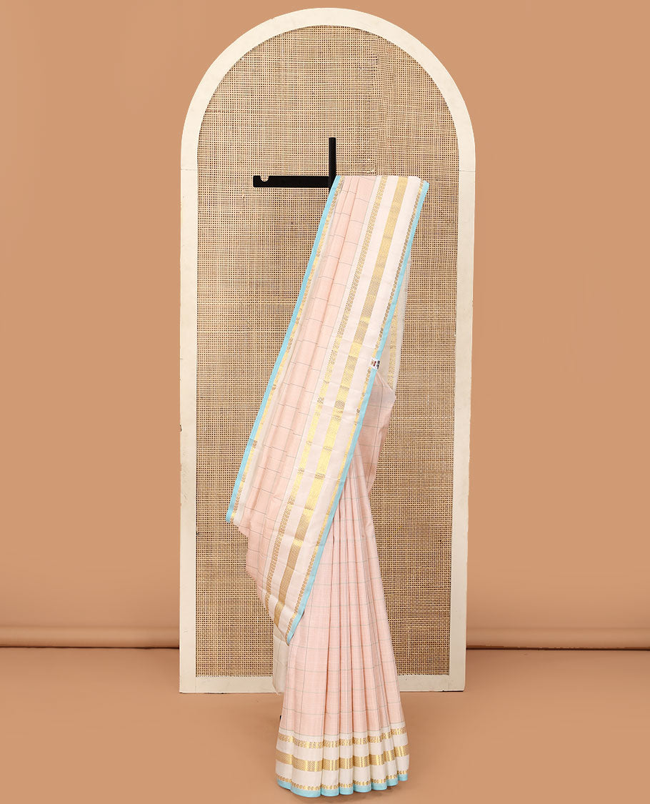 Baby pink checked Kanchipuram silk saree, contrast varisai pettu border of thilakam mokku, manga, and kuyil kann designs, and seppu rekku pallu