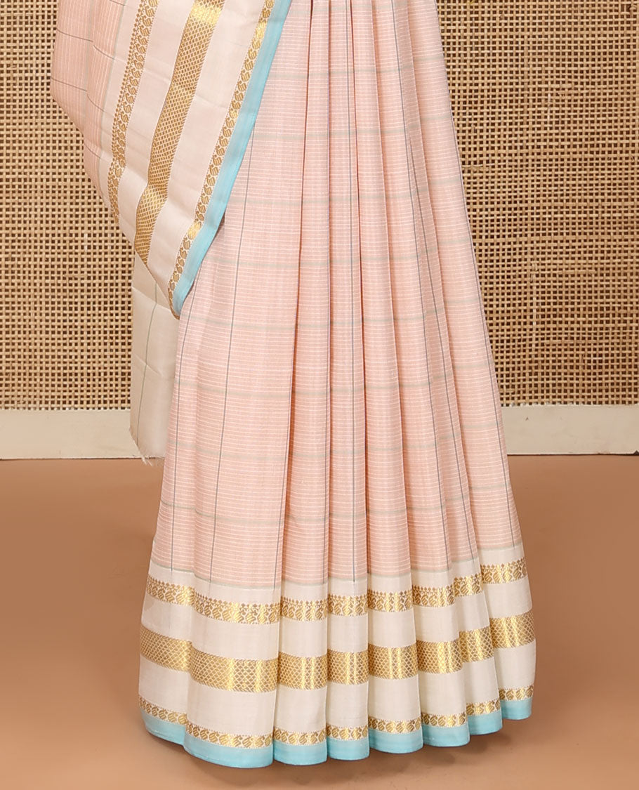 Baby pink checked Kanchipuram silk saree, contrast varisai pettu border of thilakam mokku, manga, and kuyil kann designs, and seppu rekku pallu