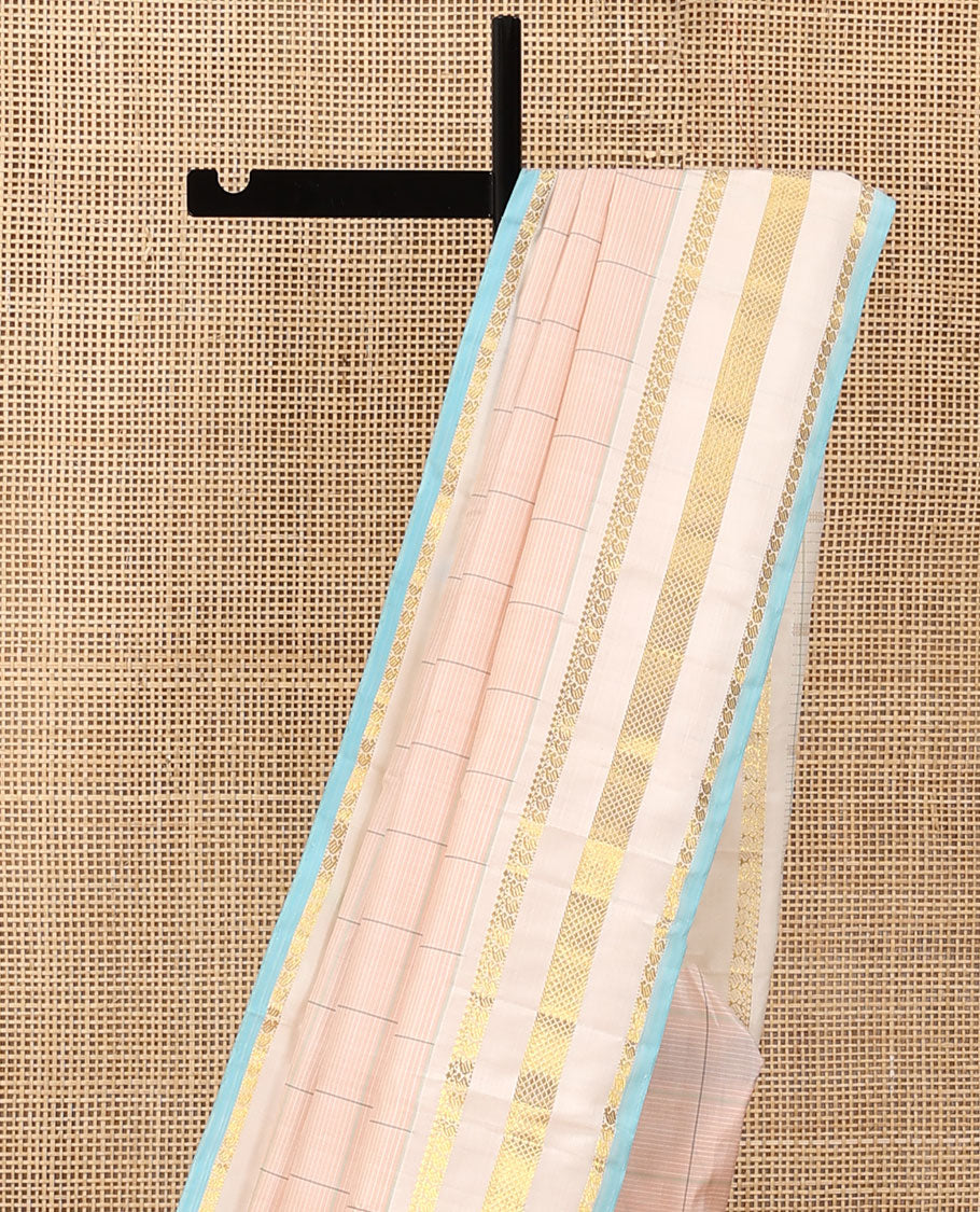 Baby pink checked Kanchipuram silk saree, contrast varisai pettu border of thilakam mokku, manga, and kuyil kann designs, and seppu rekku pallu