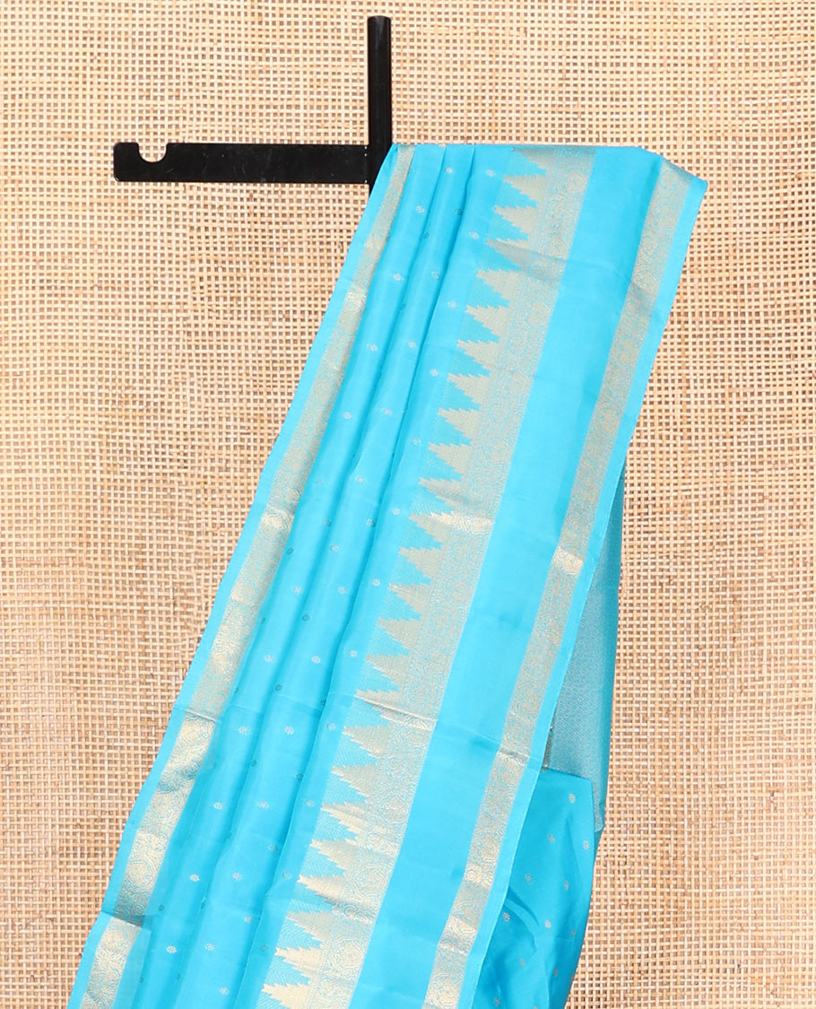 Blue Vasundhara Lite Silk Mix Saree, Subtly Sparkled with Zari Buttas All Over Its Body, Highlighted by a Zari Rettai Pettu Border of Thazampoo Rekku, Salngai, Yaanai and Mayil Designs, Gleaming Jaal Pallu, and Paired with a Matching Blouse
