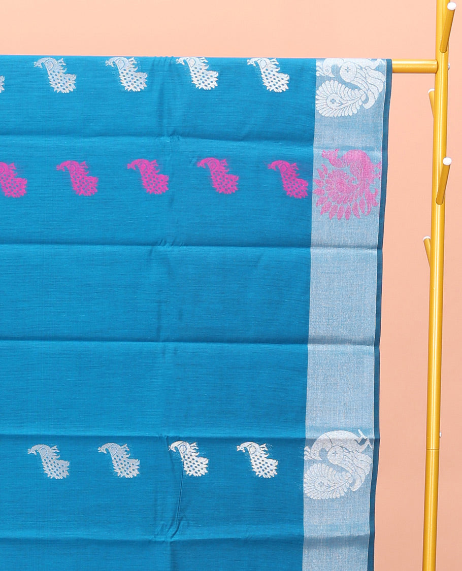 Blue Semi-Silk Cotton Saree, Uniquely Detailed with Peacock Buttas All Over Its Body, Highlighted by a Zari Border of Peacock Designs, Pallu Steeped with Peacock Zari Motifs, and Paired with a Matching Blouse