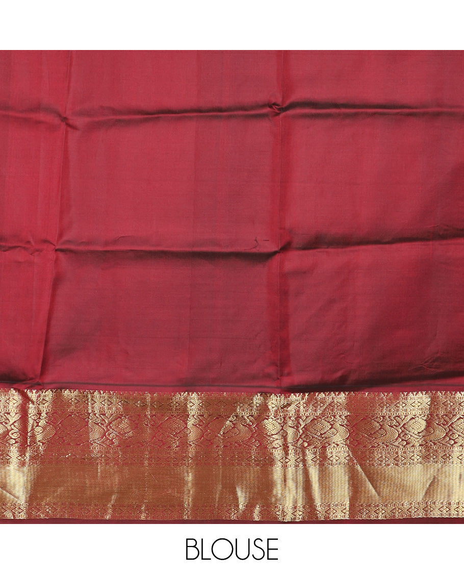 Green Vasundhara Silk Saree Adorned with Zari Stripes and Mayil Buttas, Complemented by Contrast Zari Border Featuring Diamond, Muthu, and Mayil Designs, Zari Elevated Pallu of Jaal Designs and Paired with a Contrast Blouse