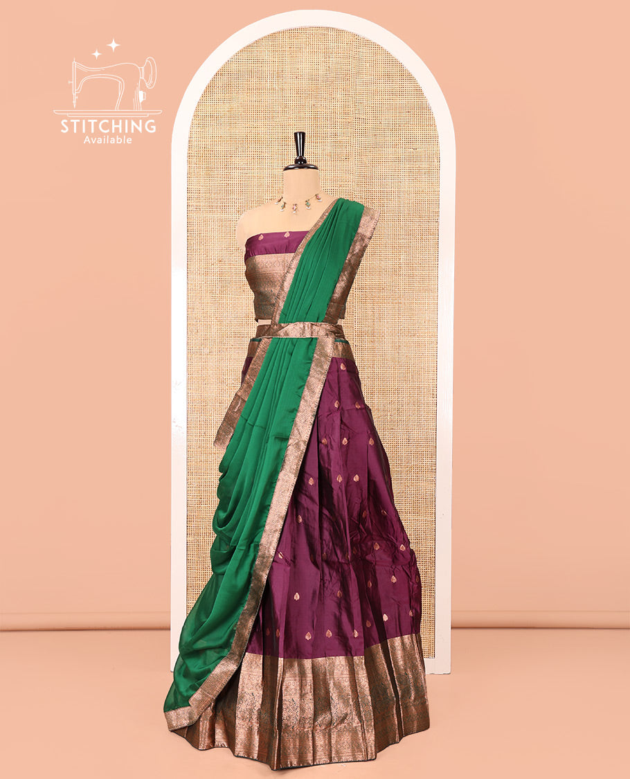 Dark Magenta-Green Semi-Banarasi Half-Saree Features Buttas Skirt,Contrast Traditional Zari Border, a Matching Blouse, and a Contrast Satin Georgette Dhavani