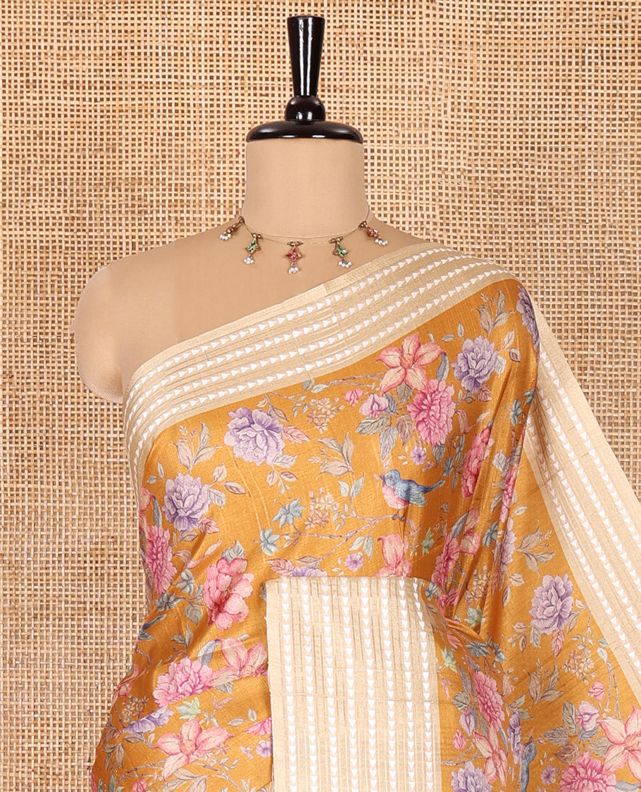 Mustard colorful floral motifs printed fancy tussar saree, contrast triangle motifs border, striped pallu, and a contrast striped blouse