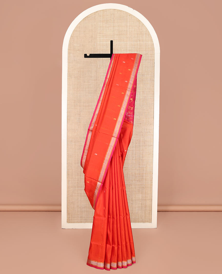 Orange Uppada Silk Saree, Decked Up with Paisley Buttas All Over Its Body, Complemented by Contrast Zari Bavanji Border, Pallu of Floral Designs, and Paired with a Contrast Blouse