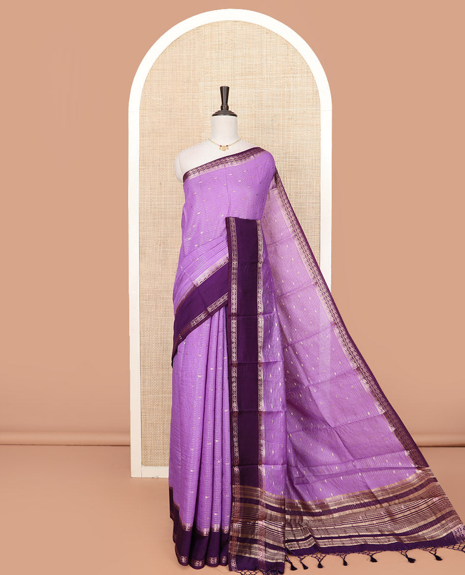 Lavender Assam Silk Saree Woven with Zari Buttas and Stripes, Complemented by a Contrast Traditional Zari Design Border, a Captivating Pallu Featuring Zari Designs, and Paired with a Contrast Blouse