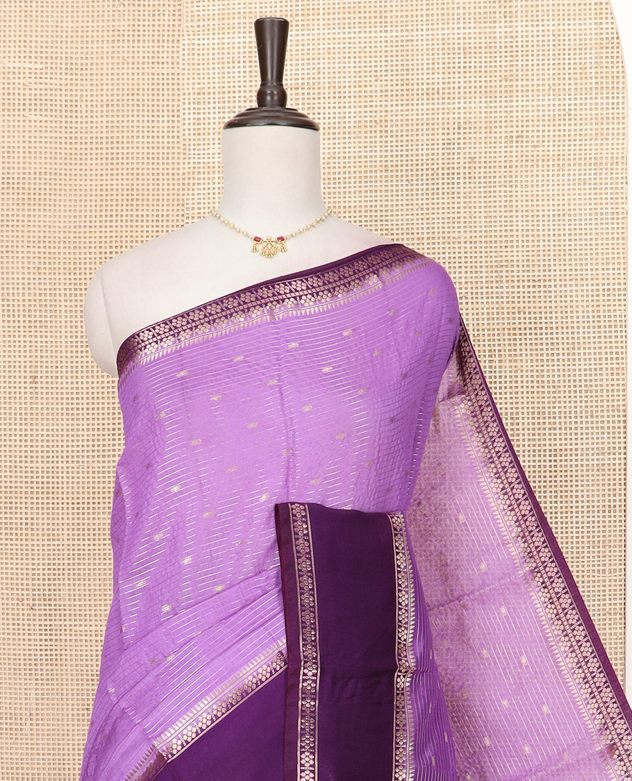 Lavender Assam Silk Saree Woven with Zari Buttas and Stripes, Complemented by a Contrast Traditional Zari Design Border, a Captivating Pallu Featuring Zari Designs, and Paired with a Contrast Blouse