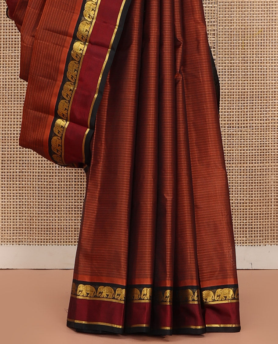 Rust Vazhaipoo Striped Kanchipuram Silk Saree, Complemented by a Contrast Rettai Pettu Border Featuring Yaanai, and Kathir Designs, Sparsely Zari Woven Pallu, and Paired with a Contrast Blouse