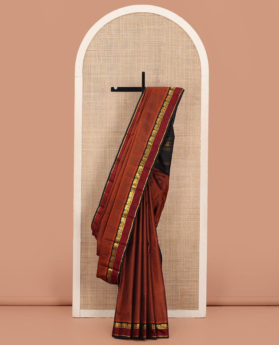 Rust Vazhaipoo Striped Kanchipuram Silk Saree, Complemented by a Contrast Rettai Pettu Border Featuring Yaanai, and Kathir Designs, Sparsely Zari Woven Pallu, and Paired with a Contrast Blouse