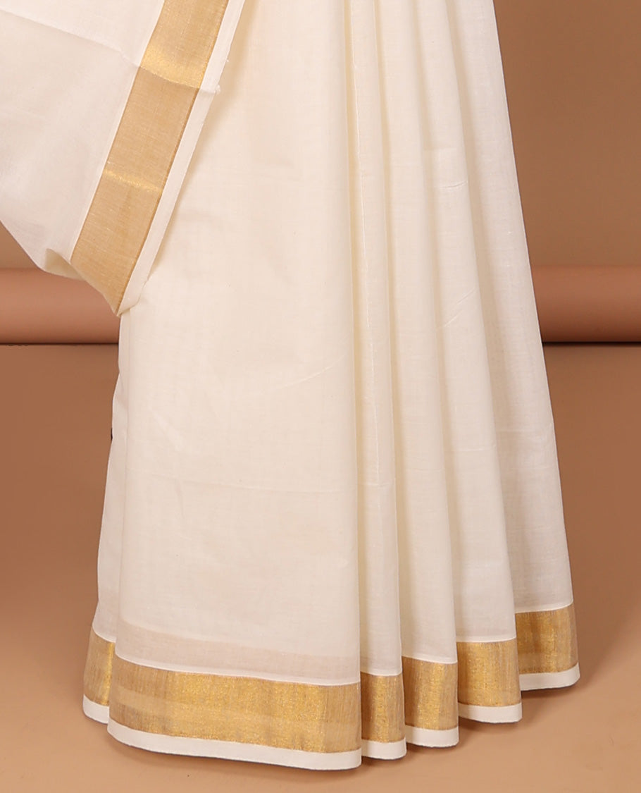 Cream kerala saree with zari stripes, zari border & pallu of peacock zari designs