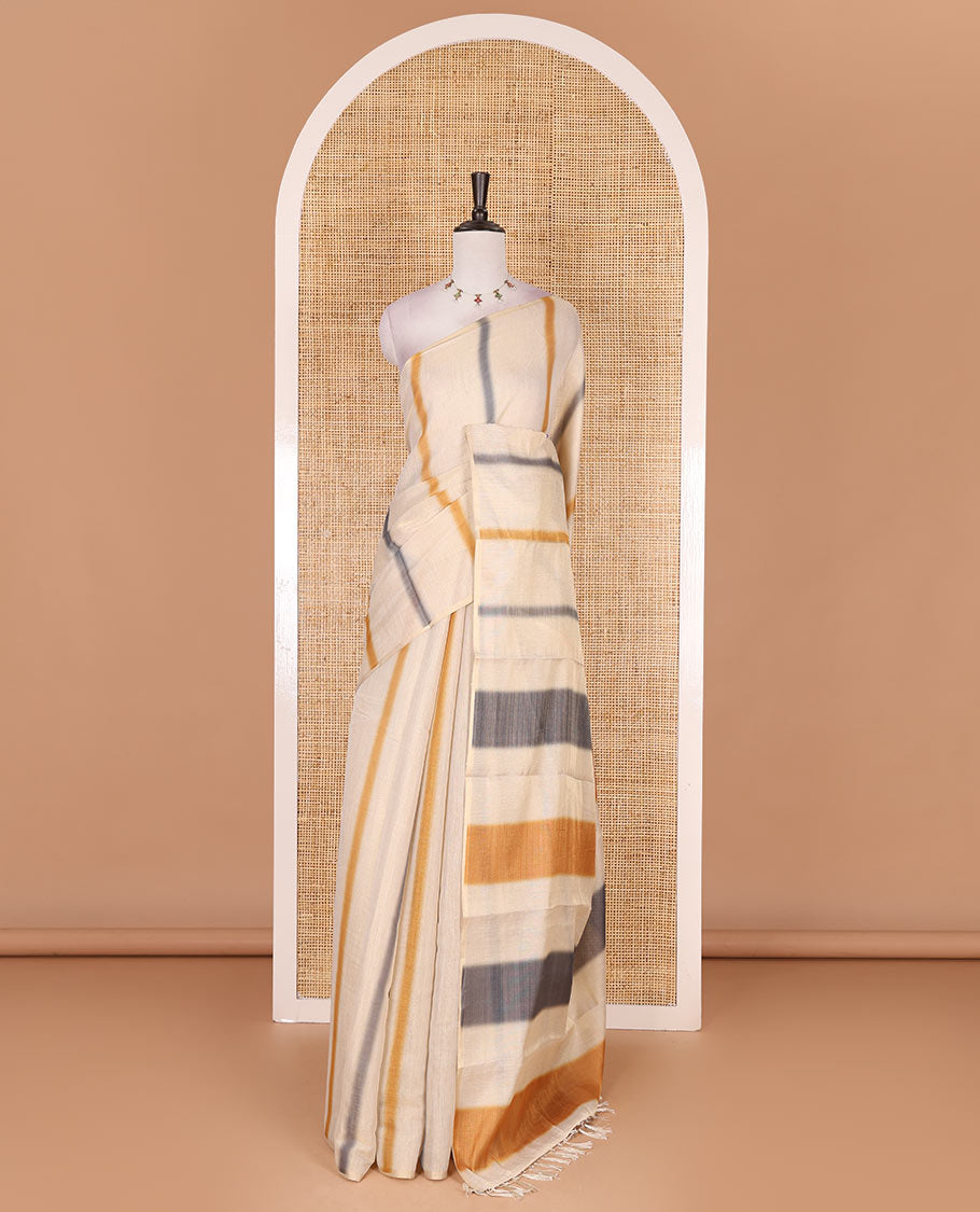 Borderless cream, colorful striped tissue saree, unique motifs printed mustard color blouse