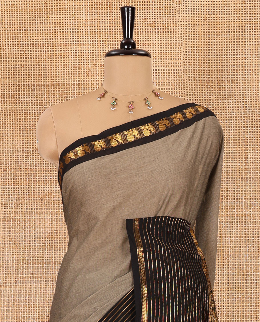 Grey plain chettinad cotton saree, contrast traditional zari border of peacock motifs, striped pallu, and a matching blouse
