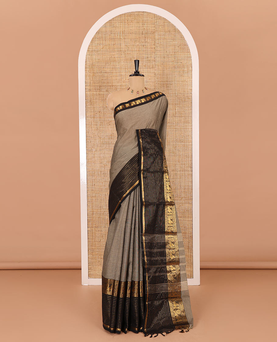 Grey plain chettinad cotton saree, contrast traditional zari border of peacock motifs, striped pallu, and a matching blouse