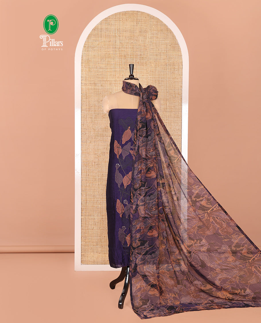 Violet Vichitra Silk Designer Material Chudidar Set, Uniquely Decorated with Floral Cross-Stiched Embroidered Top, A Subtly Plain Santoon Bottom, and Paired with a Georgette Abstract Printed Dupatta