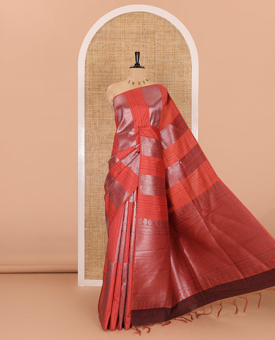 Borderless, rust orange striped, and zari traditional kanchi motifs fancy tussar saree, intricately zari-woven pallu, and a matching zari buttas woven blouse