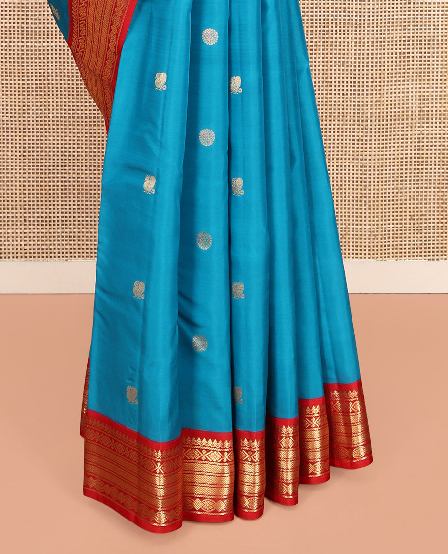 Blue Vasundhara Lite-Silk Mix Saree, Decked Up with Mayil-Chakram Buttas, Contrast Border of Thilakam Mokku, Banaras, and Vanki Design, Jaal Pallu, and a Contrast Blouse