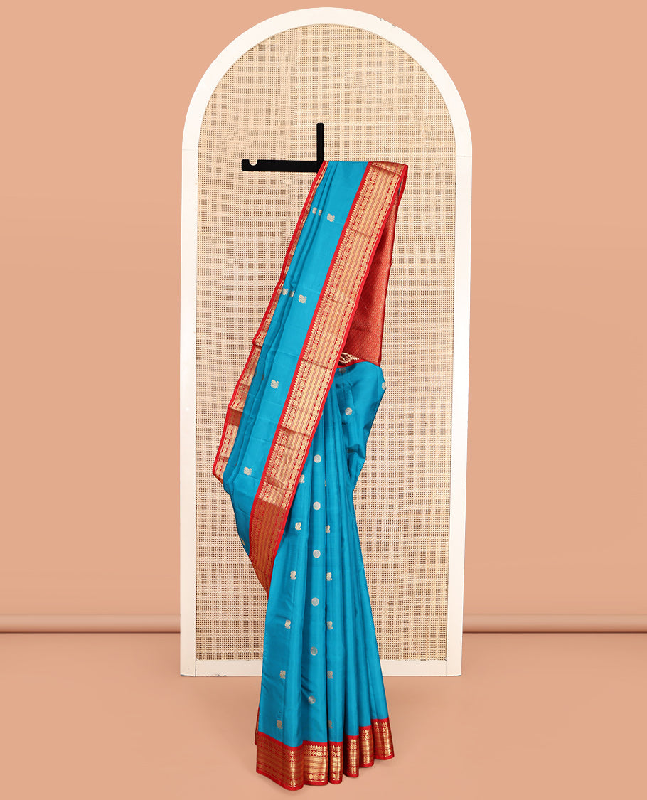 Blue Vasundhara Lite-Silk Mix Saree, Decked Up with Mayil-Chakram Buttas, Contrast Border of Thilakam Mokku, Banaras, and Vanki Design, Jaal Pallu, and a Contrast Blouse