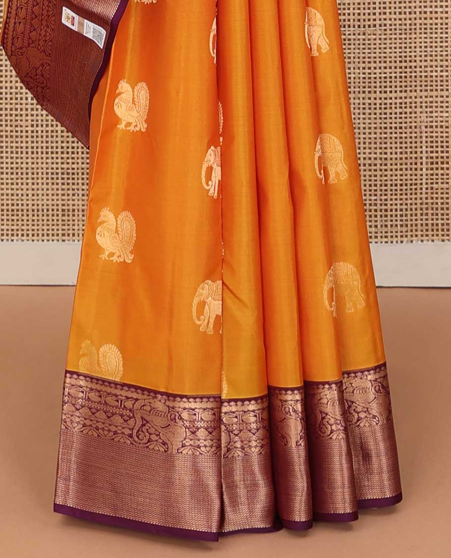 Yellow mayil and yaanai buttas silk saree, contrast border of thilakam mokku, neli, manga and yaali designs and jaal pallu
