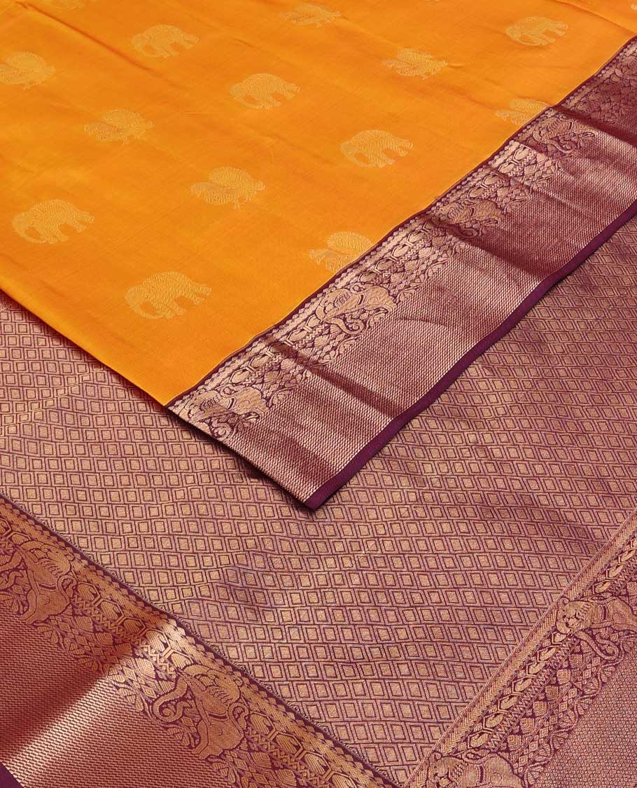 Yellow mayil and yaanai buttas silk saree, contrast border of thilakam mokku, neli, manga and yaali designs and jaal pallu