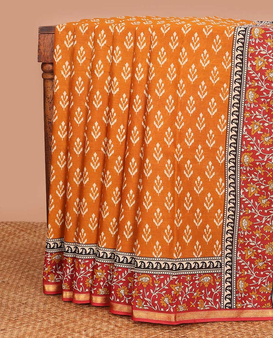 Orange unique motifs printed mul mul cotton saree, contrast floral vine printed border, and pallu of floral print