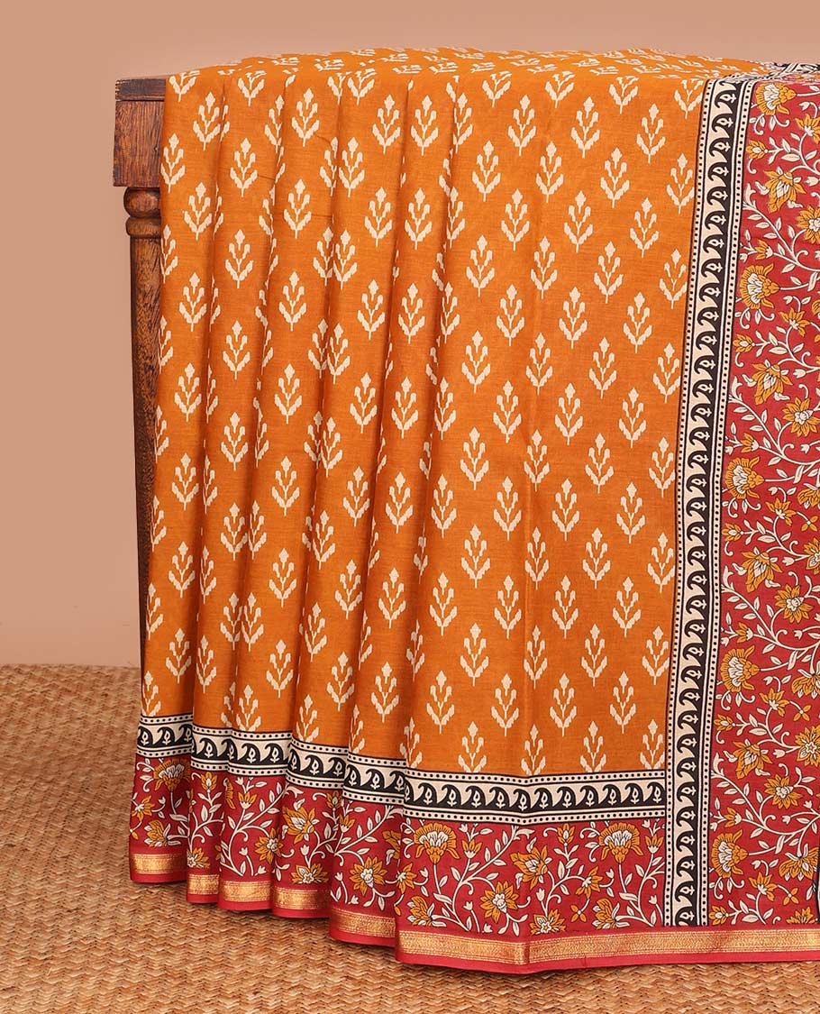 Orange unique motifs printed mul mul cotton saree, contrast floral vine printed border, and pallu of floral print