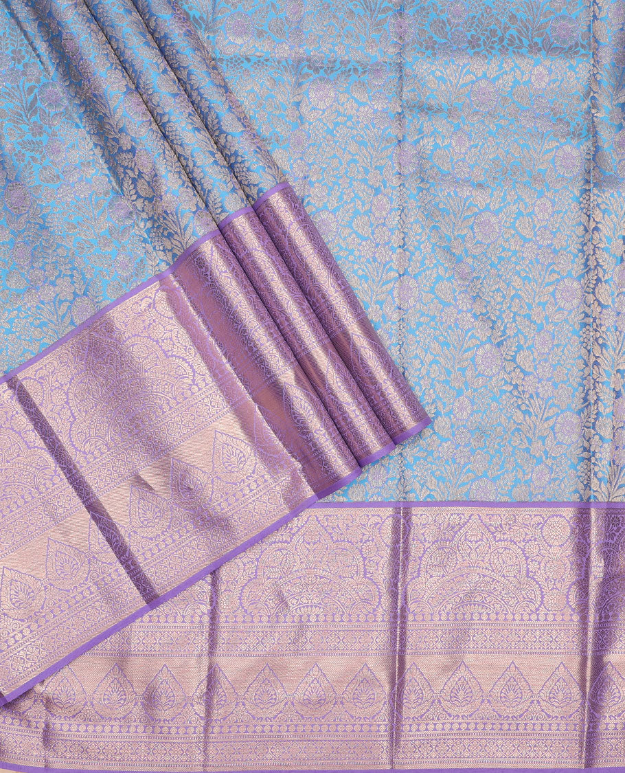 Green pure-silk half-saree, jacquard skirt, contrast blouse, and border of Mughal-style zari designs, and intricate dhavani