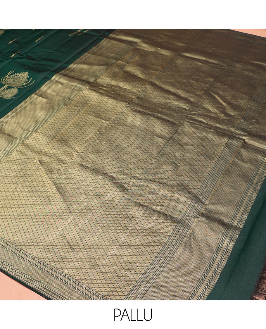 Green Vasundhara Silk Saree Creatively Designed with Thazampoo Rekku Buttas and Vel Buttas, Highlighted with a Zari Border of Manga, Muthu, Kathir, Neli, and Vanki Designs, Subtly Sparkled Pallu of Jaal Design, and Paired with a Matching Blouse