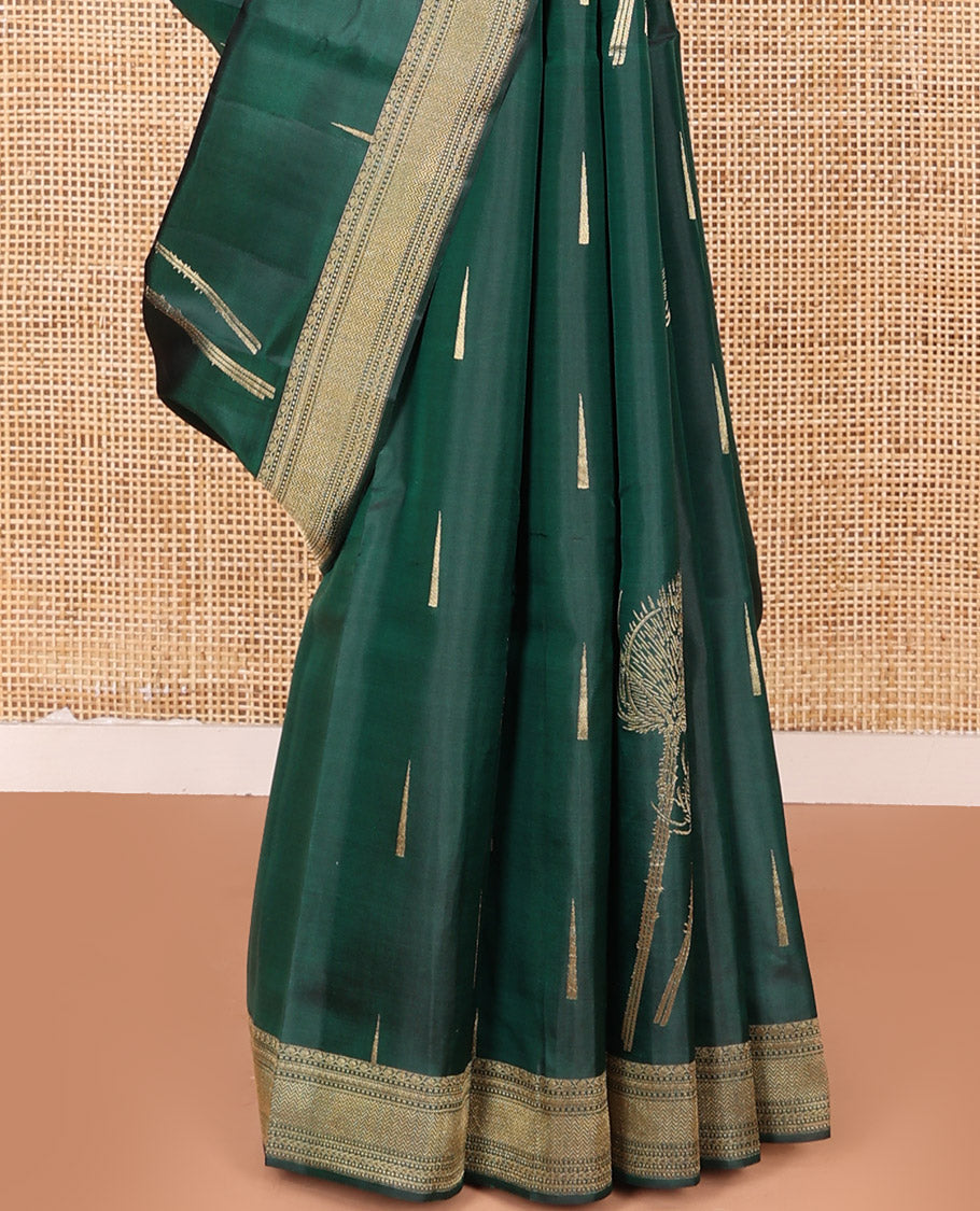 Green Vasundhara Silk Saree Creatively Designed with Thazampoo Rekku Buttas and Vel Buttas, Highlighted with a Zari Border of Manga, Muthu, Kathir, Neli, and Vanki Designs, Subtly Sparkled Pallu of Jaal Design, and Paired with a Matching Blouse