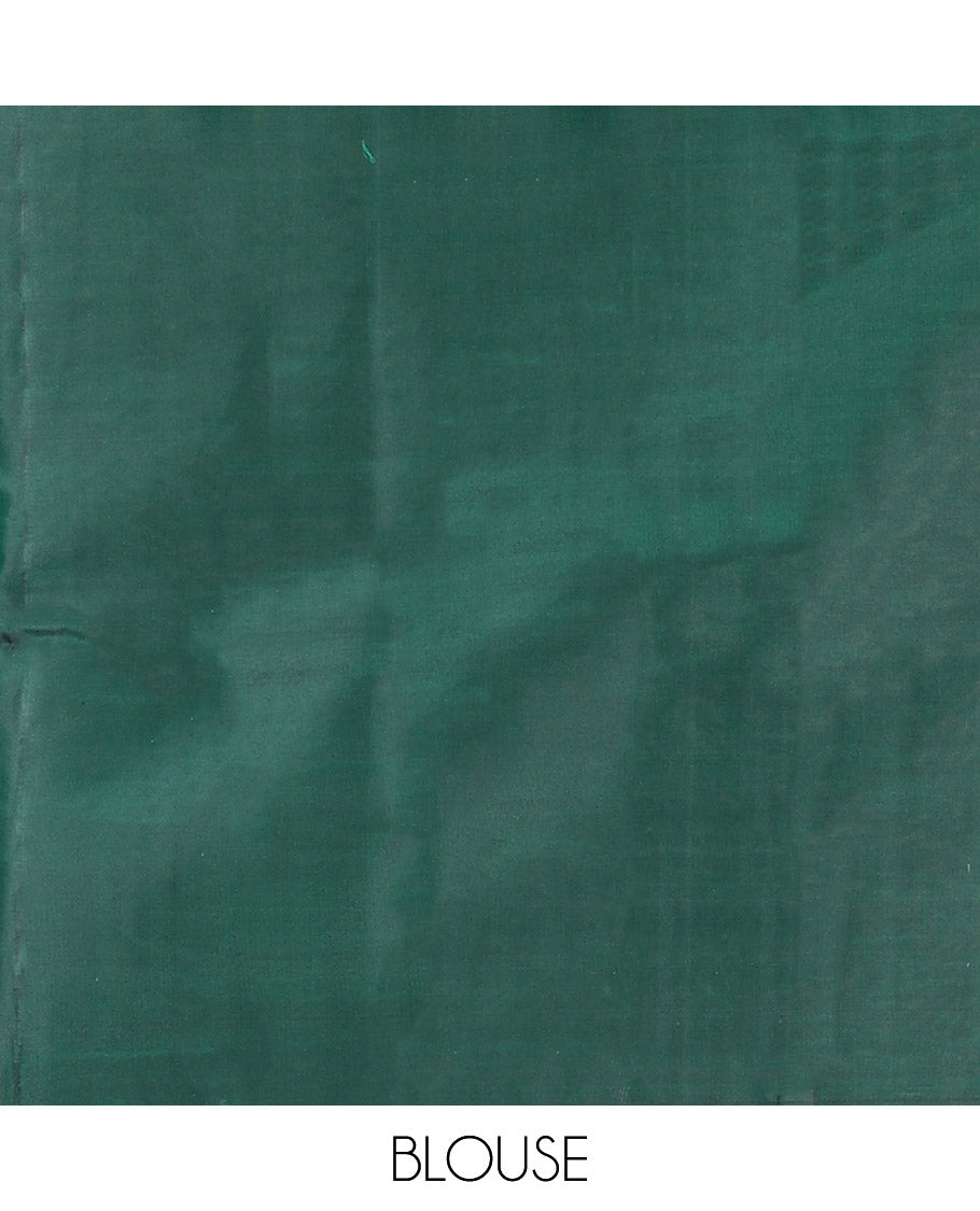 Green Vasundhara Silk Saree Creatively Designed with Thazampoo Rekku Buttas and Vel Buttas, Highlighted with a Zari Border of Manga, Muthu, Kathir, Neli, and Vanki Designs, Subtly Sparkled Pallu of Jaal Design, and Paired with a Matching Blouse