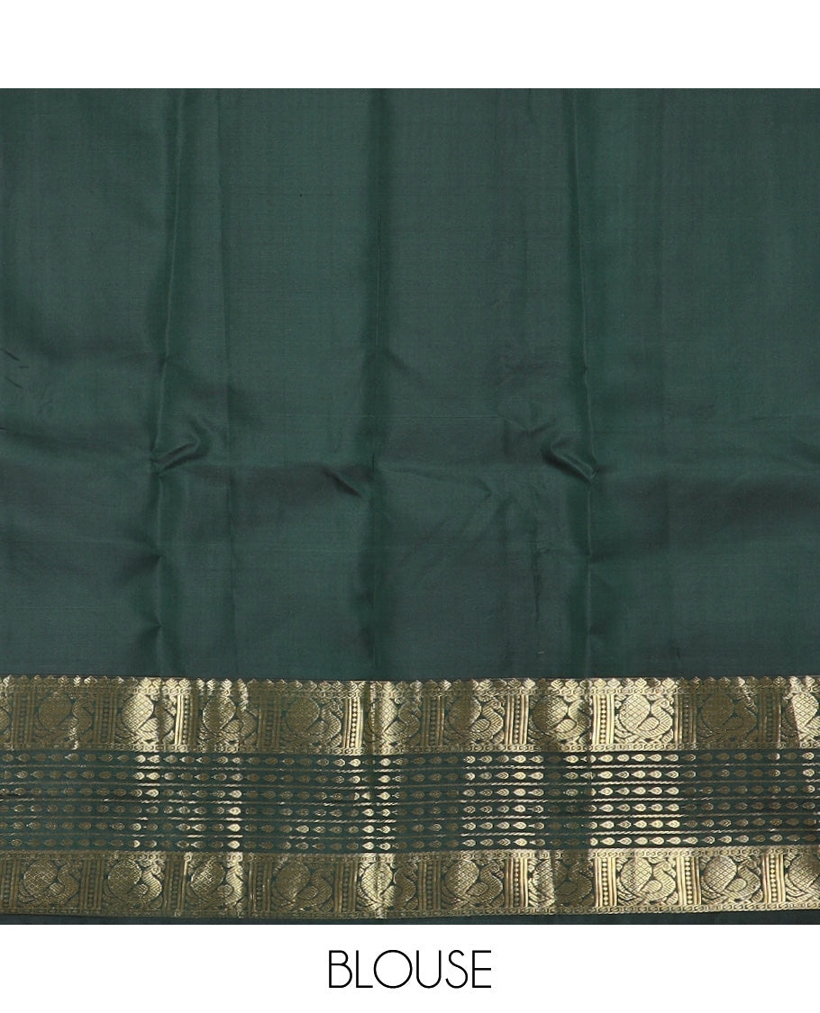 Tomato red zari buttas silk saree, contrast border of thilakam mokku, banaras, thilakam, and mayil designs, and zari-rich jaal design