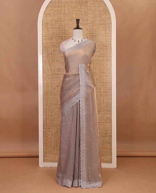 Grey Swarovski crystal stone embedded fendy chiffon saree, scallop Swarovski stone embroidered border, and contrast plain blouse