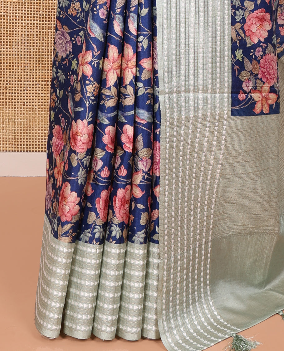 Royal blue colorful floral motifs printed fancy tussar saree, contrast triangle motifs border, striped pallu, and a contrast striped blouse