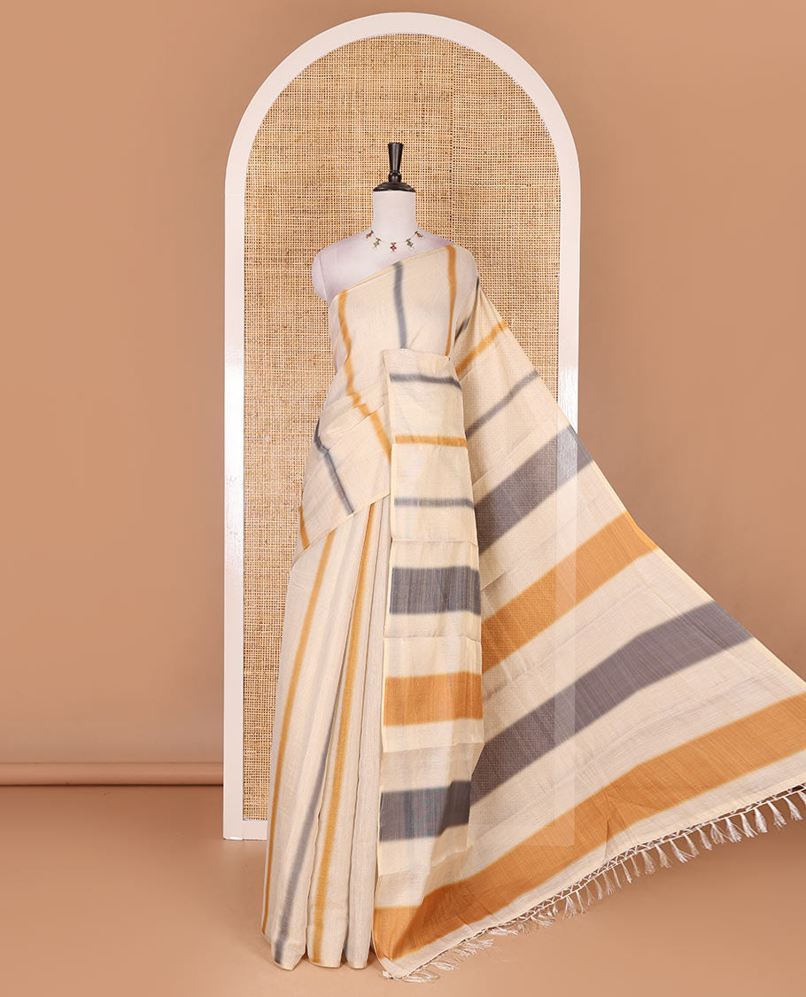 Borderless cream, colorful striped tissue saree, unique motifs printed mustard color blouse