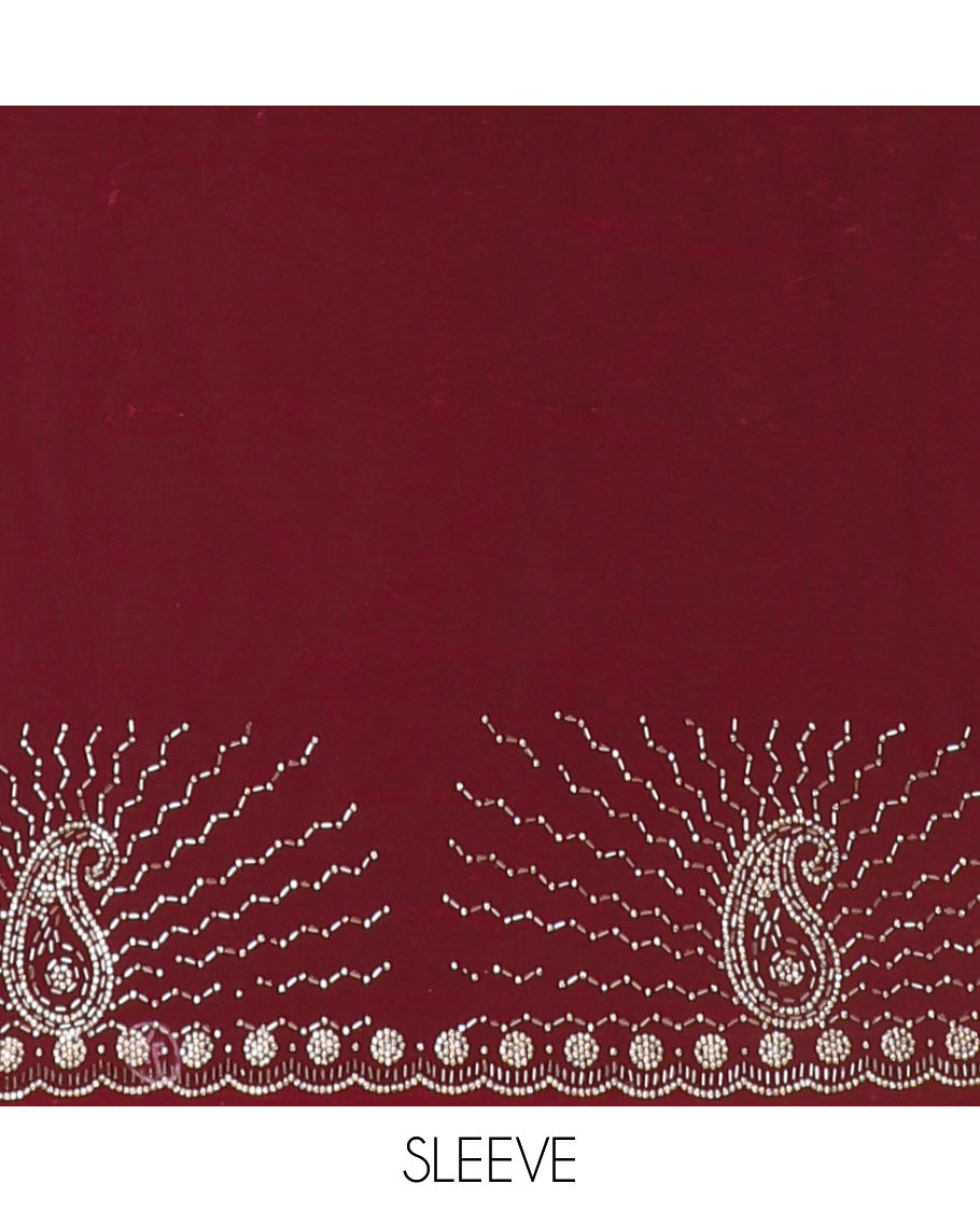 Red micro-stone work fendy chiffon saree with paisley stone work on its shoulder, a scallop stone work border, a butterfly style pallu, and a matching stone work blouse