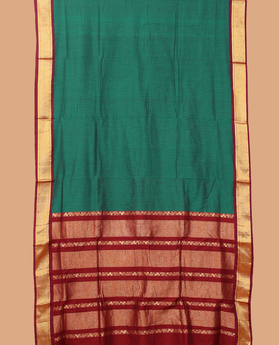 Green plain nine-yard cotton saree, contrast traditional zari border, and pallu of traditional designs