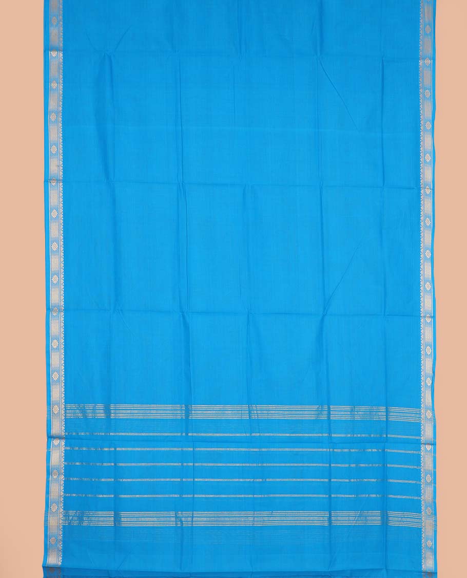 Sky blue plain nine-yard cotton saree, traditional zari border, and striped pallu