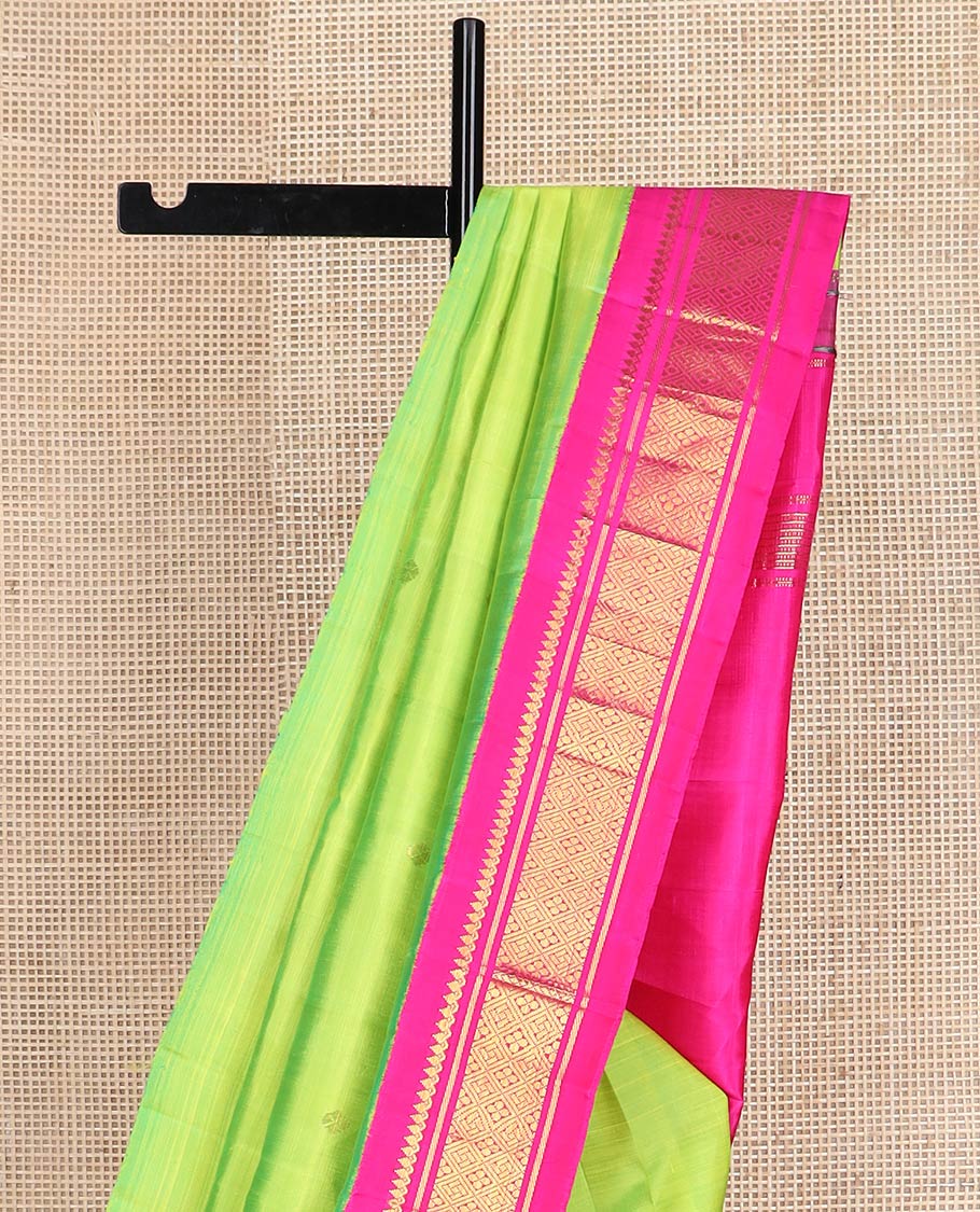 Parrot green zari buttas kanchipuram silk saree, contrast one-sided korvai border of salngai,banaras,muthu & jaal & zari design pallu